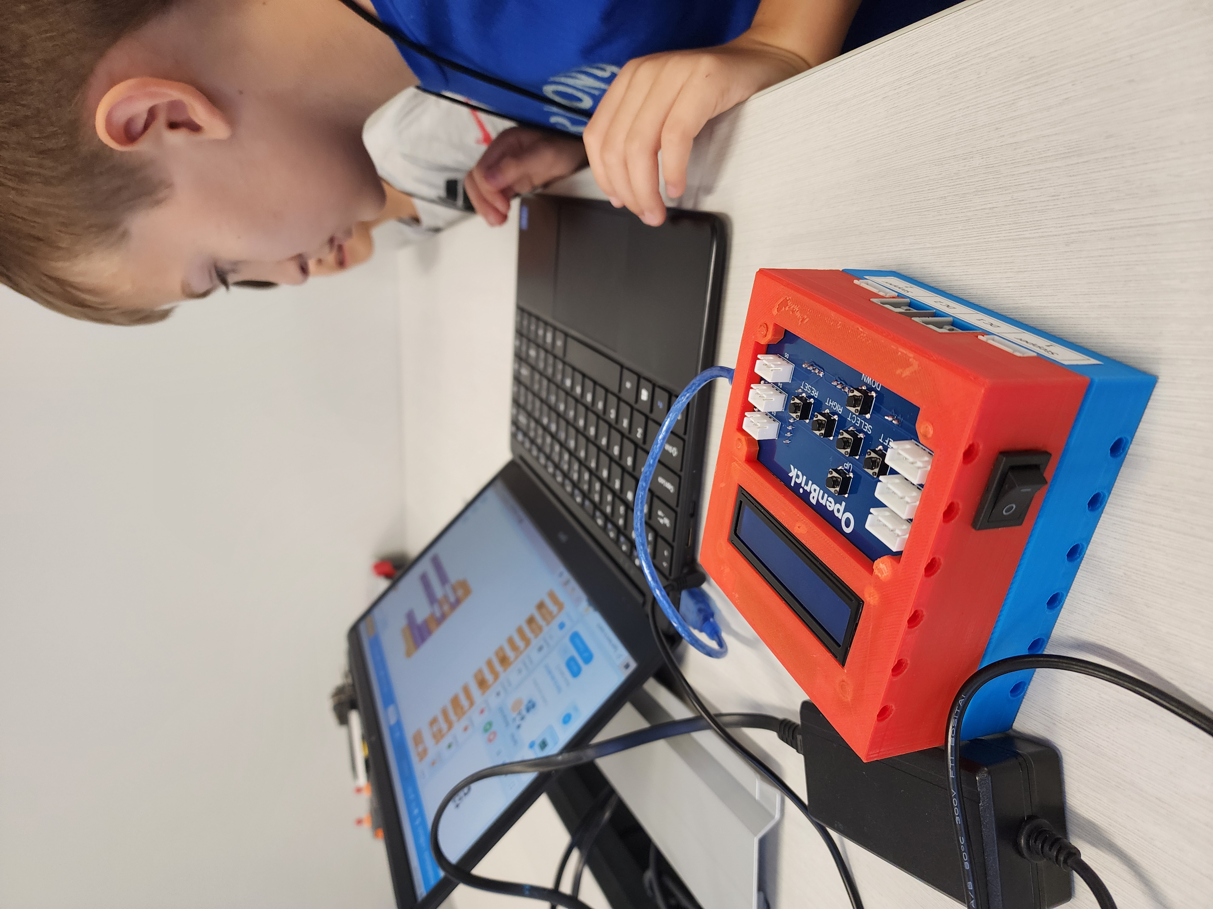 Child building coding skills during STEM camp