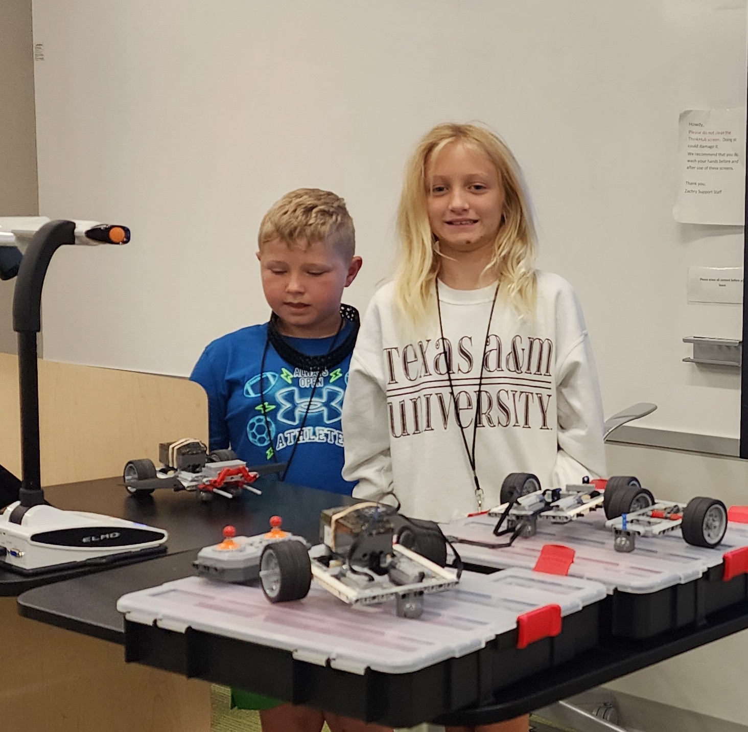 Students showing their STEM robotics projects