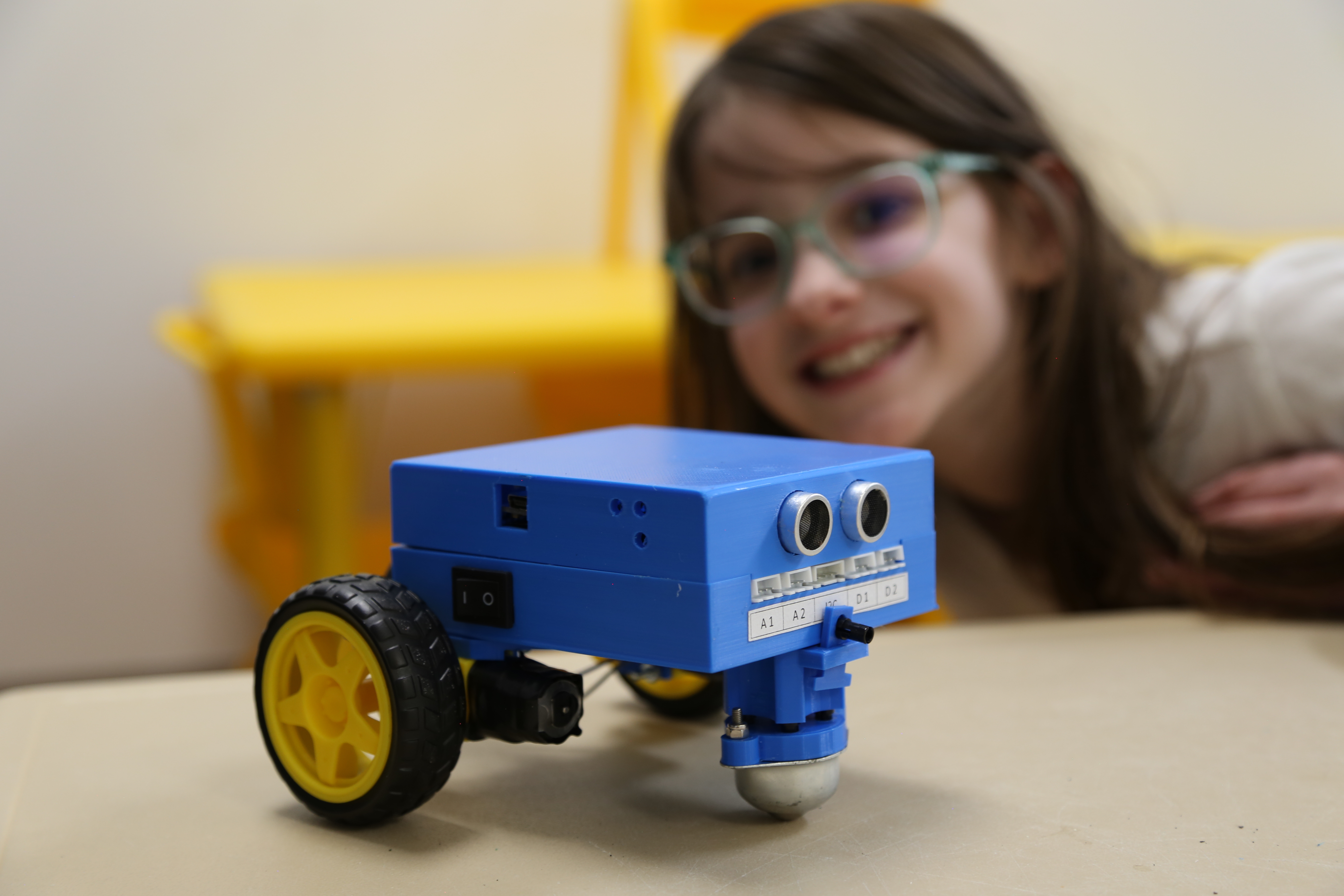 Student with a robotics build in class